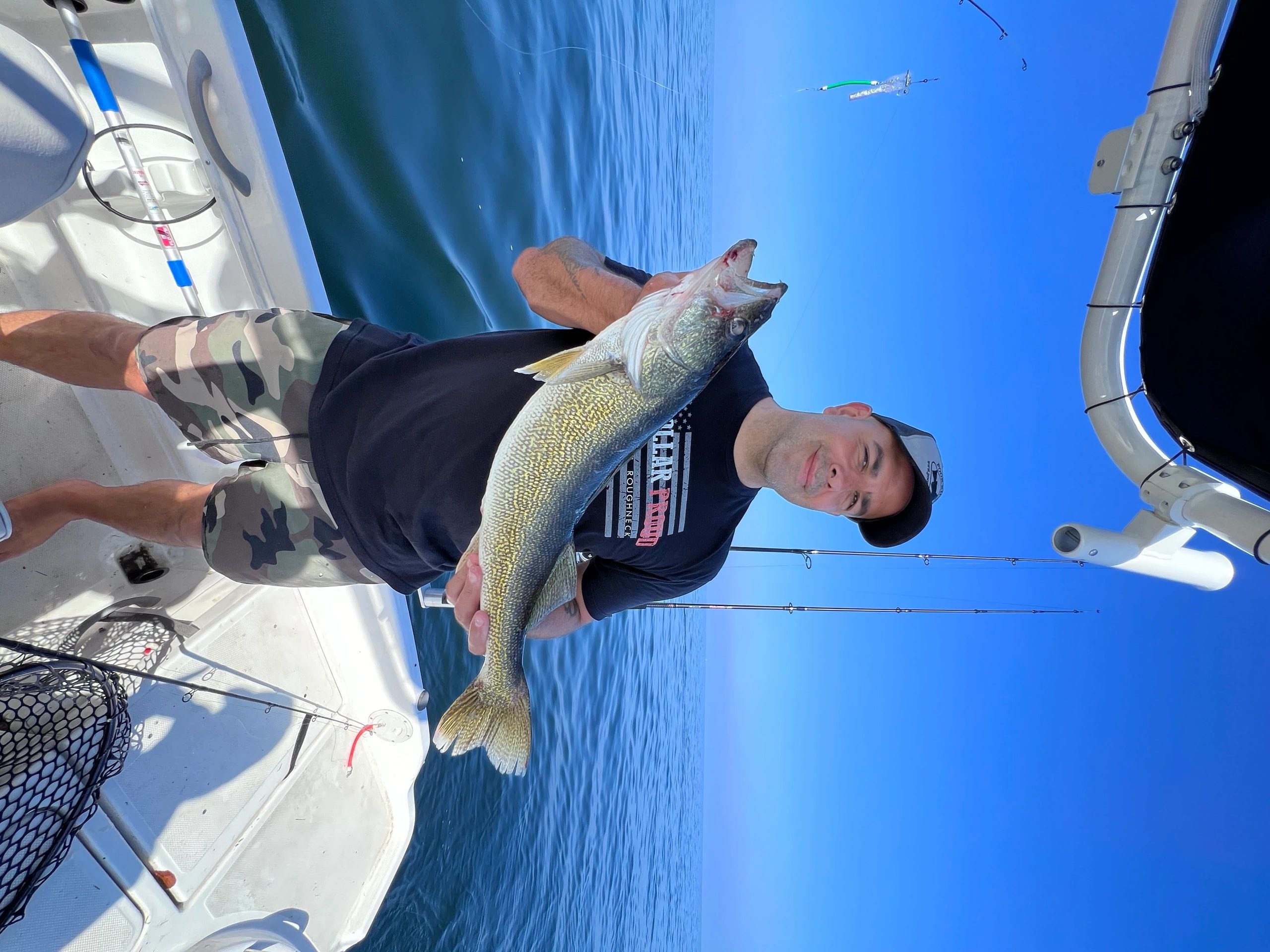 Captain Craig Claflin holding a walleye on Lake Erie